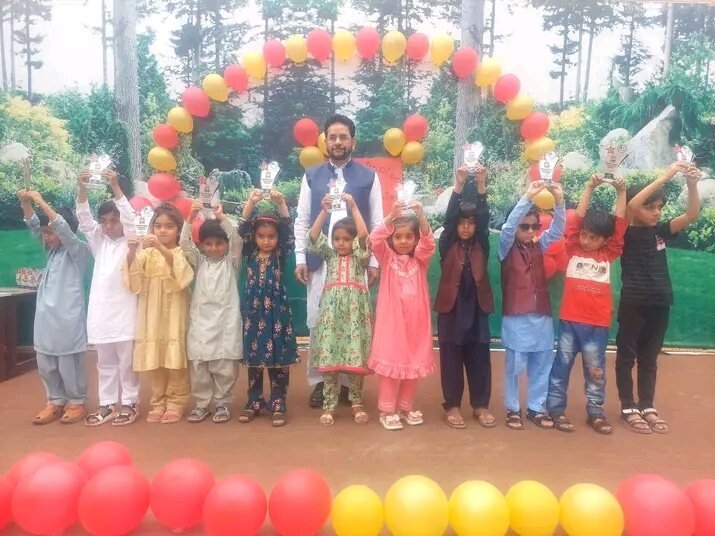Young students holding up prizes at an Edutop award ceremony